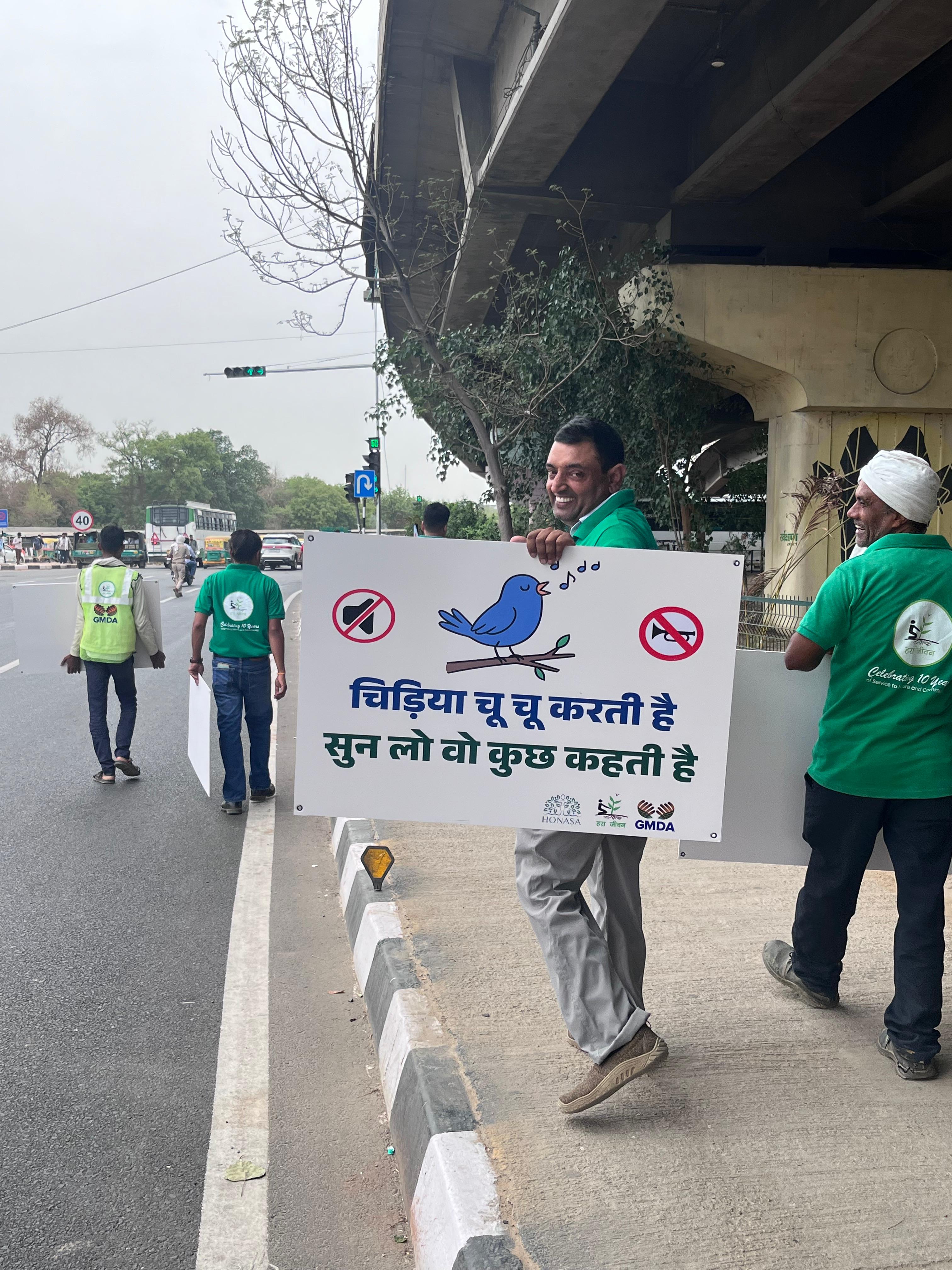 Volunteers explaining noise impact to commuter